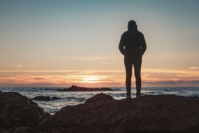 standing watching the sunrise.